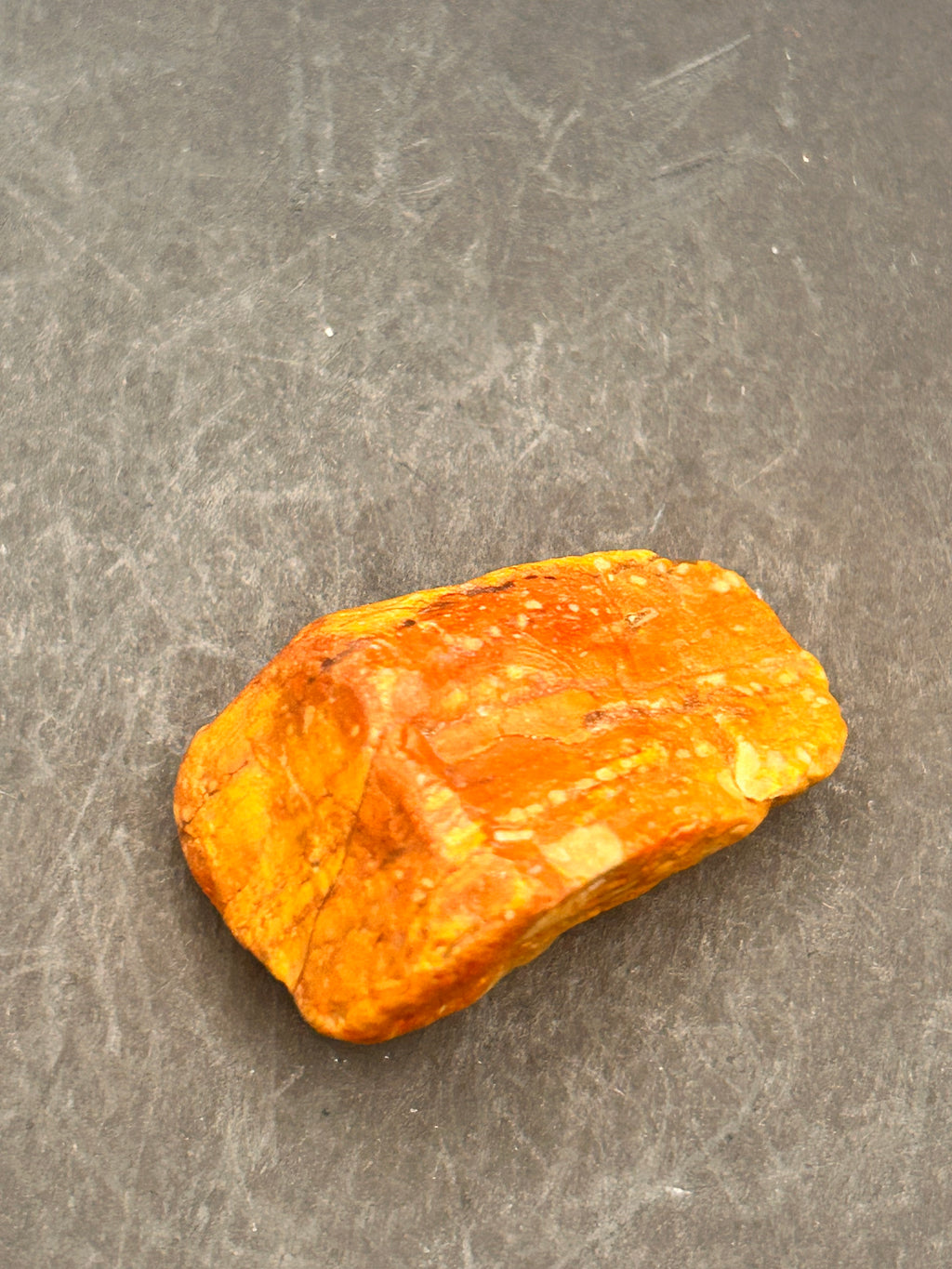 Amberroot Emberstone (1.05 oz) is a vivid fragment of petrified, jasperized wood