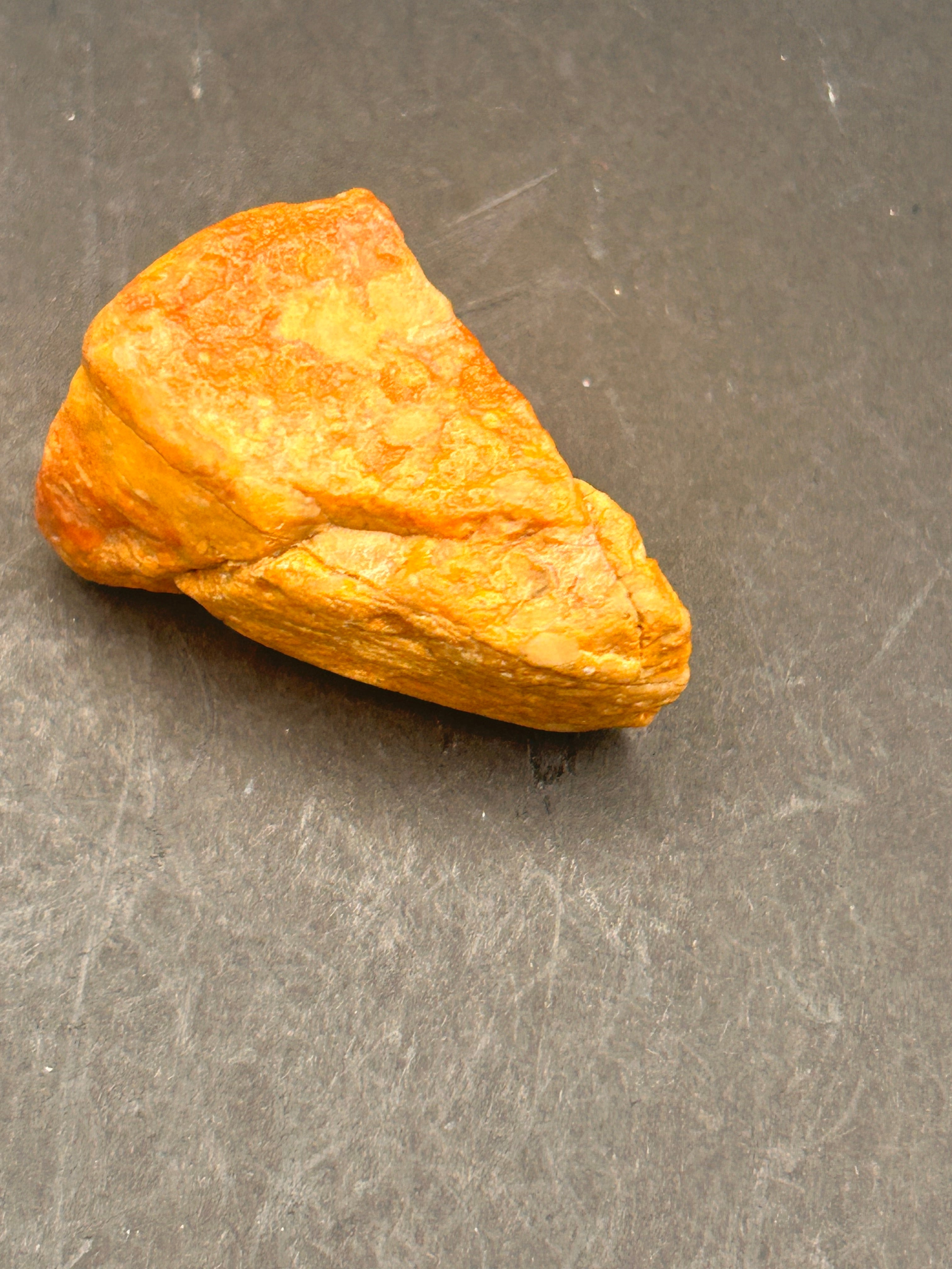 Amberroot Emberstone (1.05 oz) is a vivid fragment of petrified, jasperized wood